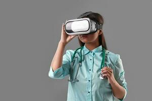 Young attractive doctor in a virtual reality glasses photo