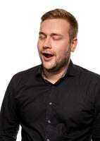 Portrait of caucasian yawning man. He is exhausted and tired because of a lot of work photo