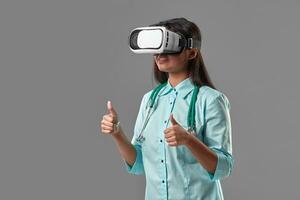 Young attractive doctor in a virtual reality glasses photo