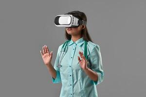 Young attractive doctor in a virtual reality glasses photo