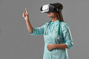 Young attractive doctor in a virtual reality glasses photo