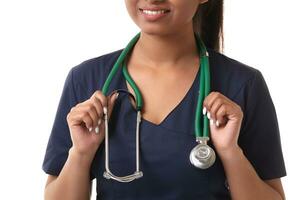 Beautiful young doctor with a stethoscope, isolated on white photo