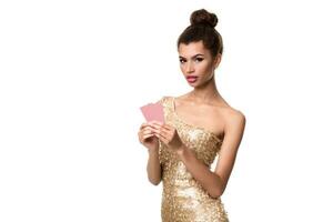 Pretty african girl shows two cards in casino poker and win photo