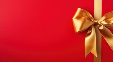 AI generated gold bow and ribbon on red surface photo