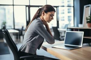 AI generated businesswoman suffering from backache while working with laptop at office desk, Back Pain Bad Posture Woman Sitting at office, AI Generated photo