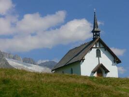 a white church with a steeple photo