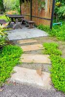 Stone curved walkway in garden photo