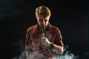 A young man with a beard and a stylish hairstyle in a shirt, smoking a cigarette, a viper, a room, a studio, smoke, enjoyment photo