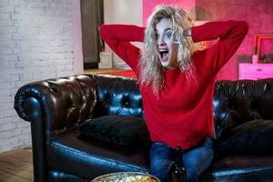 Beautiful woman raised hand celebrating football support team wi photo