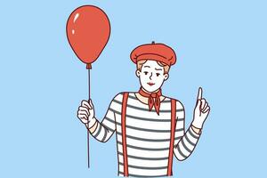 Mime man holding red balloon and pointing finger up, participating in pageant or circus. Mime guy with white face, dressed in long-haired t-shirt and getting ready to make audience laugh vector