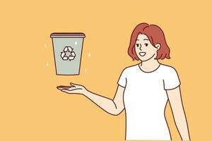 Woman displays trash can with recycling sign and calls for sorting garbage to take care environment vector