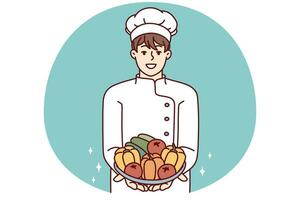 Man restaurant chef holds plate with fresh vegetables offering to make vegetable salad. Vector image