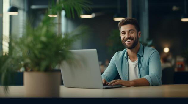 AI generated cheerful man smiles in office and looking at laptop photo