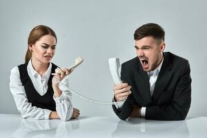 picture of man and woman with telephone at the table photo