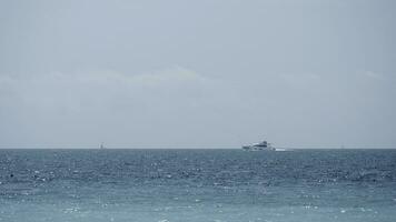 Beautiful calm sea and blue cloudy sky. Action. Amazing horizon and the endless sea water. photo