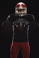 Football player on dark background photo