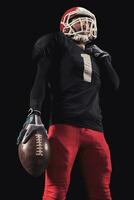 Football player on dark background photo