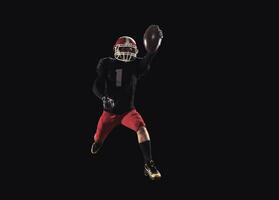 Football player on dark background photo