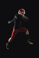 Football player on dark background photo