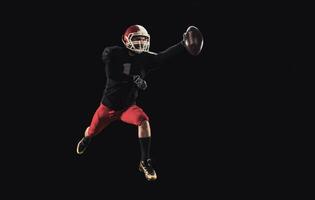 Football player on dark background photo