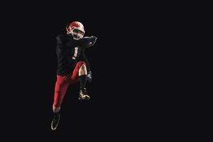 Football player on dark background photo