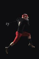 Football player on dark background photo