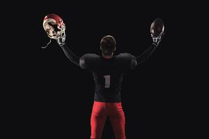 Football player on dark background photo