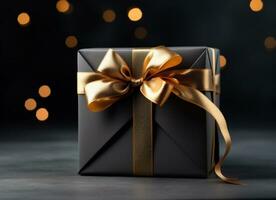 AI generated elegantly tied golden ribbon wrapped in black gift box on black background photo