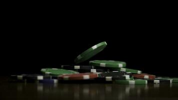 Falling poker chips isolated on black background. Falling poker chips isolated on black background. Colorful poker chips falling at the table on black background. Playing chips flying at the black photo