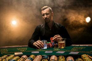 Man is playing poker with a cigar and a whiskey. A man winning all the chips on the table with thick cigarette smoke. photo