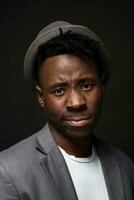 Portrait of attractive young black male studio on dark background photo