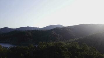 Beautiful landscape nature of rainforest and mountain background. Top view of tropical mountains on a Sunny day photo