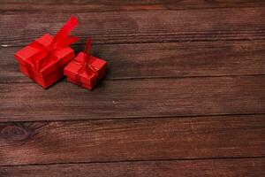 Gift boxes on wooden table. Collection of gift boxes on wooden board holidays concept. Presents for any holiday concept photo