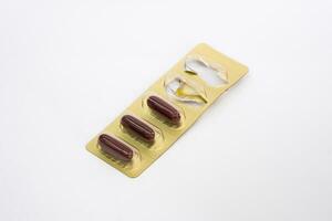 Ginseng capsules in foil blister pack photo