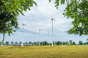 Wind turbines alternative energy in field photo
