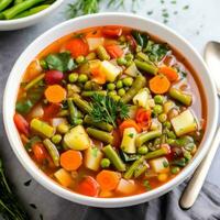 AI generated A hearty and healthy vegetable soup with chunks of colorful veggies and sprig of fresh herbs on top photo