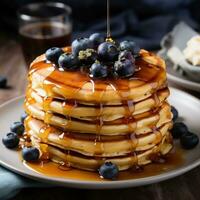 AI generated A stack pancakes topped with fresh blueberries and drizzled with syrup on background photo