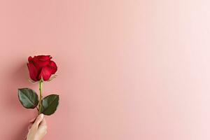 AI generated Hand holding a red rose with copy space photo