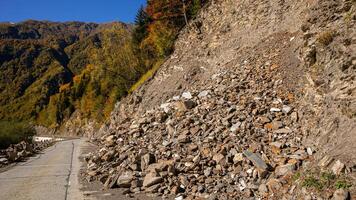 Autumn Rockslide Obstructs Mountain Roadway photo