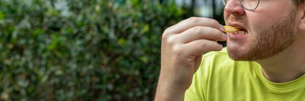 AI generated Man Enjoying Snack in Vibrant Outdoors photo