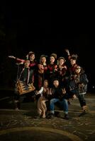 a group of Indonesian dancers with happy facial expressions and looking unified when wearing red costumes that look stunning photo