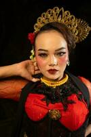 an Asian dancer with dazzling makeup and captivated the audience at night photo