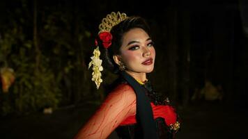 an Indonesian dancer with sparkling stage lights that create the impression of luxury and elegance photo