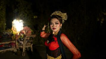 an Indonesian dancer with sparkling stage lights that create the impression of luxury and elegance photo