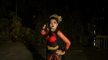 an Indonesian dancer with sparkling stage lights that create the impression of luxury and elegance photo