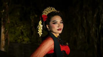 an Indonesian dancer with sparkling stage lights that create the impression of luxury and elegance photo