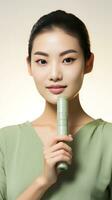 AI generated A woman holding a jade roller against her cheek. The roller is a light green color photo