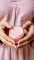 AI generated A woman's hands holding a small pot of lip balm photo
