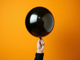 AI generated A black balloon on a orange background photo