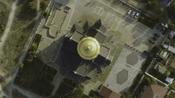 Top view on great christian church with golden dome. Shot. The dome of the Church in the center of the screen photo